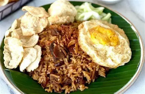 Teknik Memasak Nasi Goreng proses memasak nasi goreng babat dengan api besar