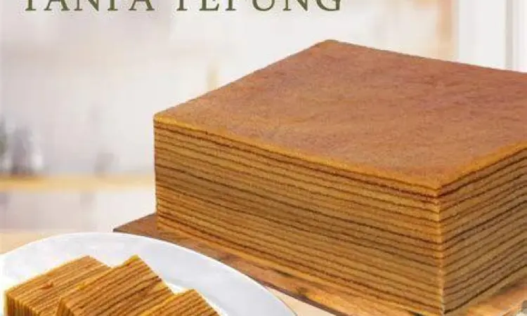 Tekstur Lapis Legit Berkualitas Irisan lapis legit premium dengan tekstur lembut dan berminyak